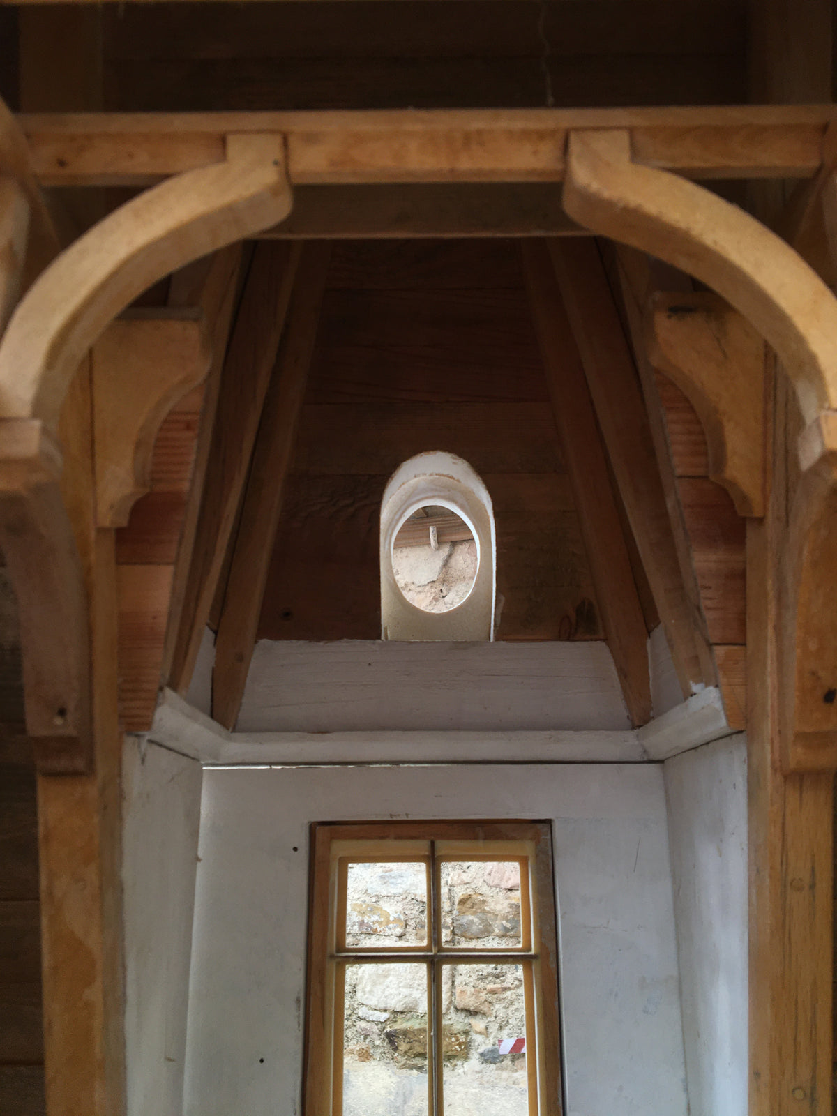 Interior of Lady Admiral’s Château under construction in the Lansdown Arts studio, showing its handmade timber framework and architectural detailing for the 2026 London collection.