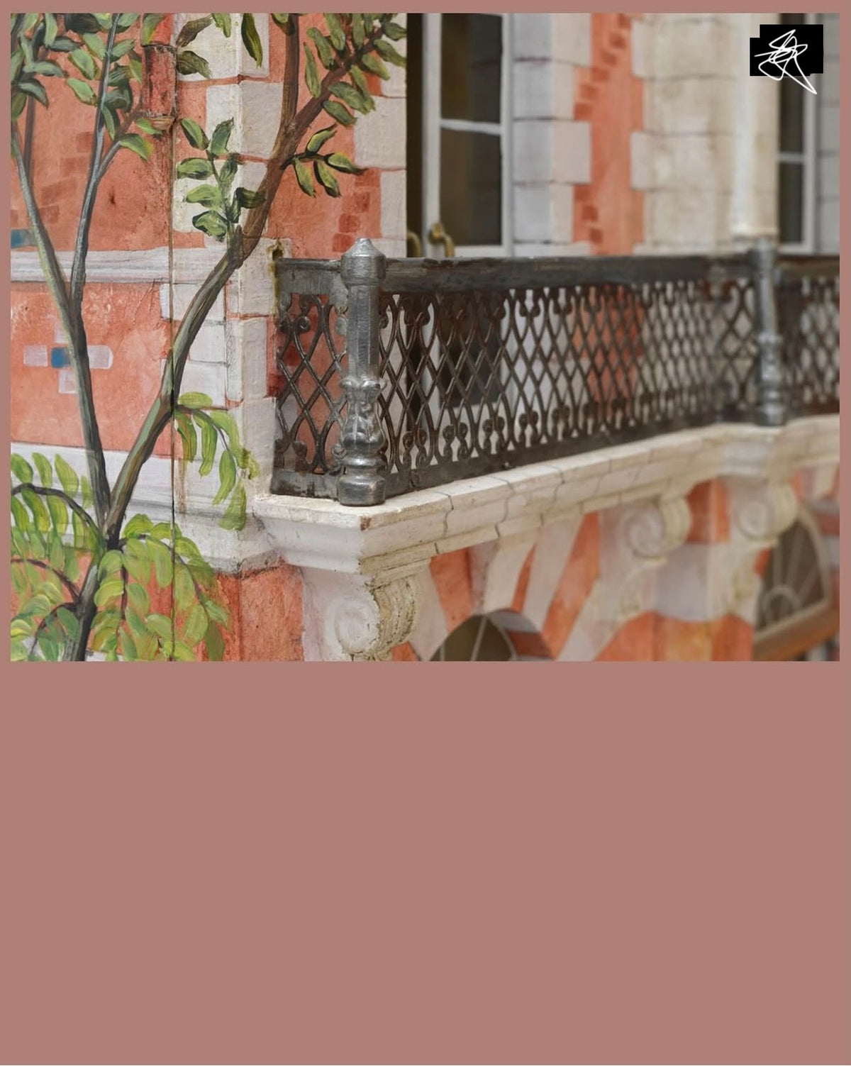Traditional decorative painting and miniature metalwork balcony on the Red Brick Second Empire architectural dollhouse.