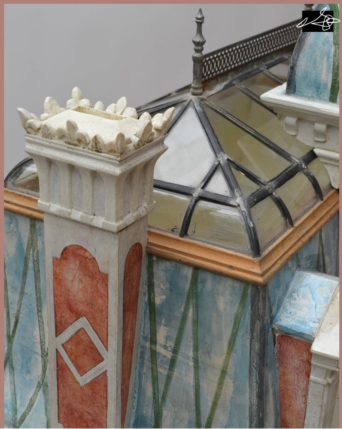 Hand-sculpted ornamental roof cresting beside the curved glass mansard on the Red Brick Second Empire dollhouse.