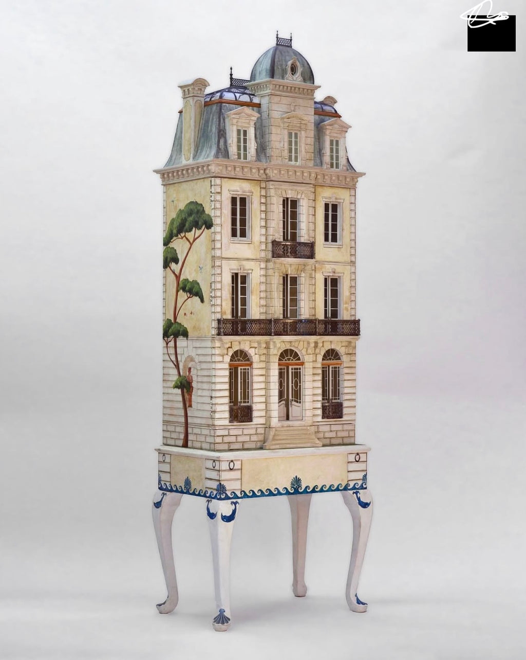 Low-angle view of Whitestone architectural dollhouse with French doors, arched fanlights and hand-cast metal balconies.