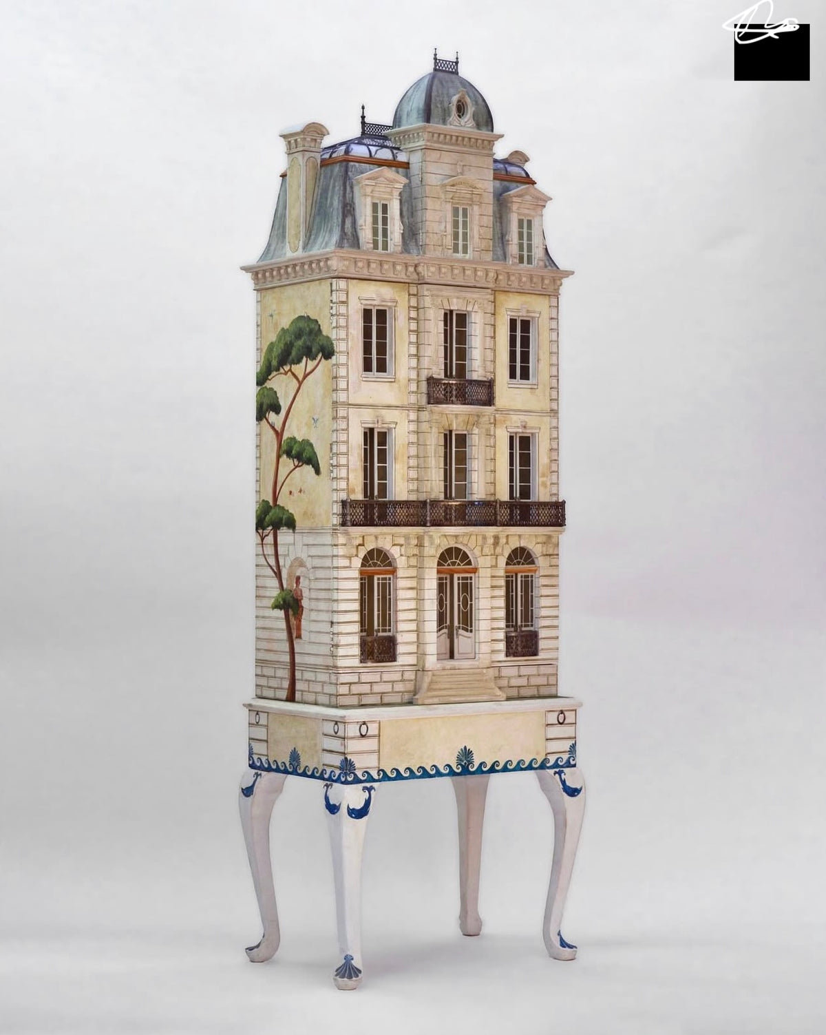 Low-angle view of Whitestone architectural dollhouse with French doors, arched fanlights and hand-cast metal balconies.