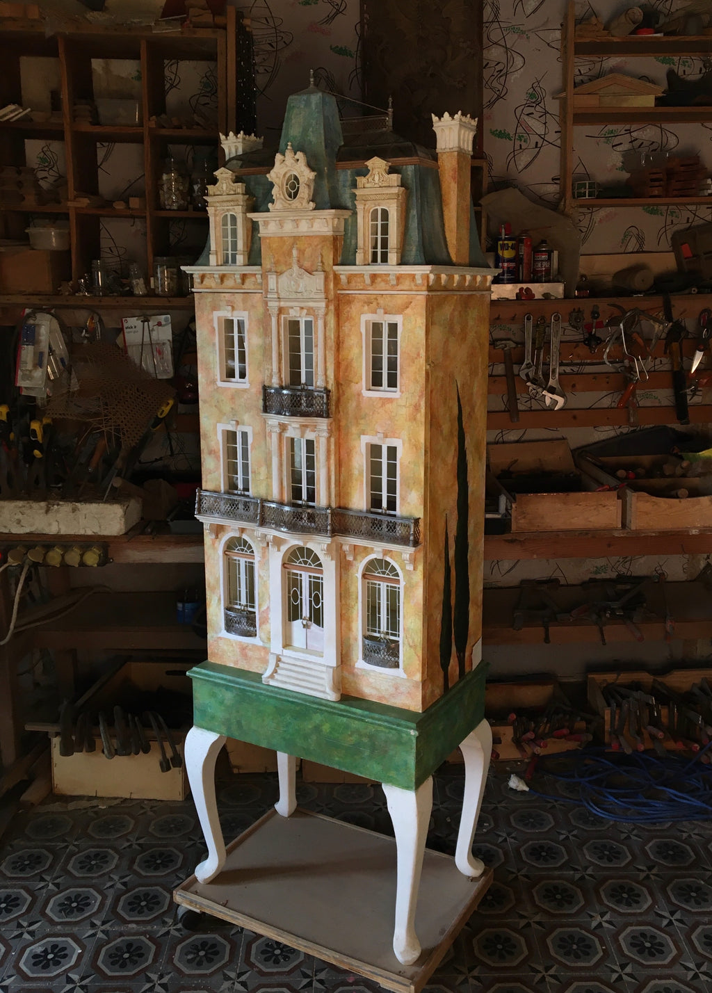 Cypress Tree Glass Roof House, a tall handcrafted French dollhouse with cypress murals, mansard roof and metal balconies.
