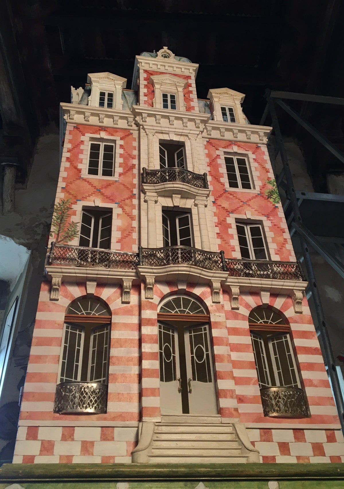 Napoleon III mansard roof, dormer windows and carved cornice on the Red Brick collectible architectural dollhouse.