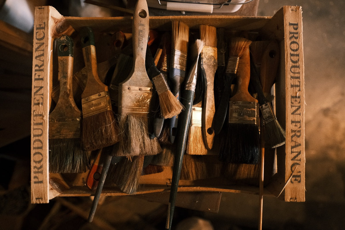 Vintage French paintbrushes in Eric Lansdown’s artisan studio, tools for hand-painted dollhouse finishes and decorative art