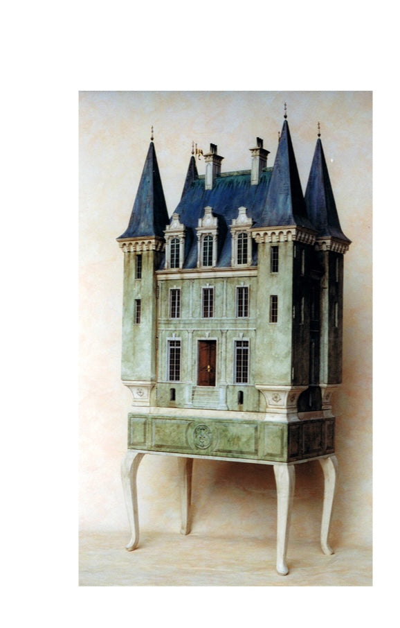 Completed French château architectural dollhouse with twin slate towers, a hand-painted façade and intricate traditional detailing by Eric Lansdown.