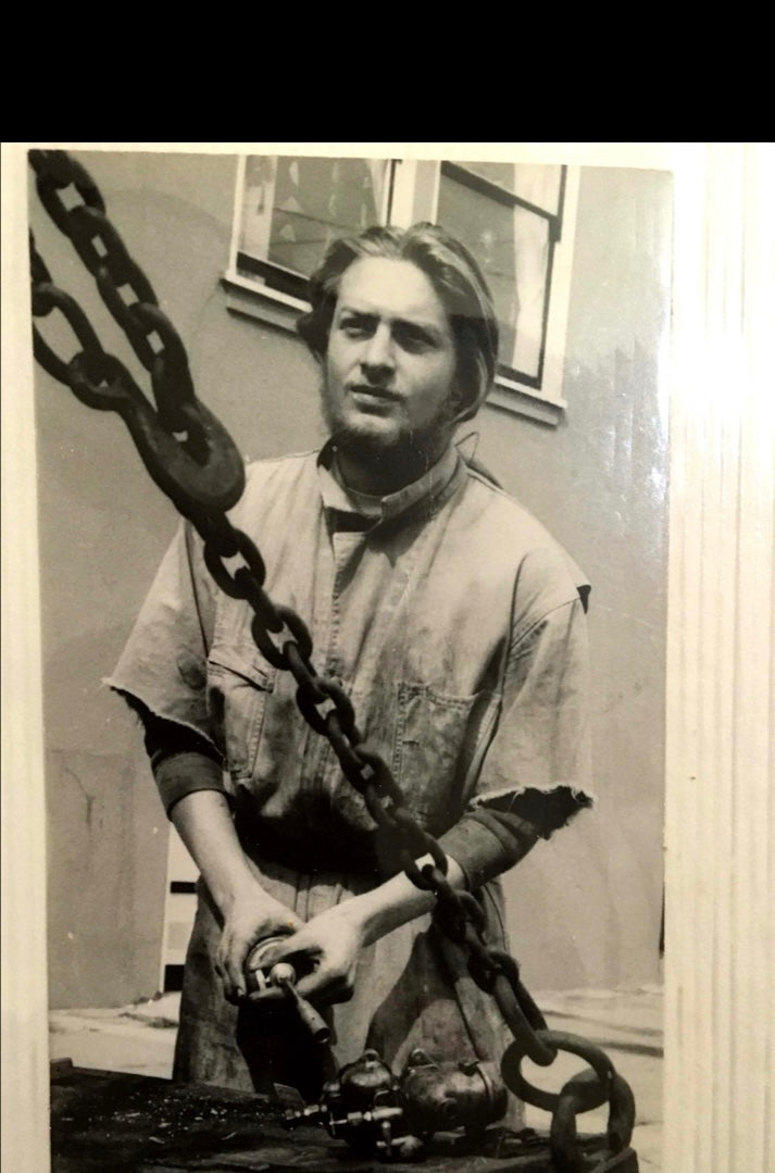Young Eric Lansdown in his floating San Francisco workshop, where he began creating handmade architectural dollhouses and aviaries.