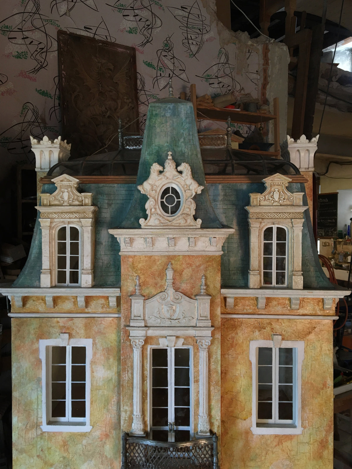 Green patinated mansard and curved glass roof lanterns with ornate dormers on the Cypress Tree Second Empire dollhouse.